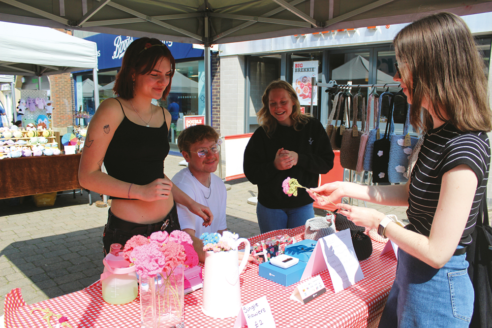 Young market trader 2025 event stall