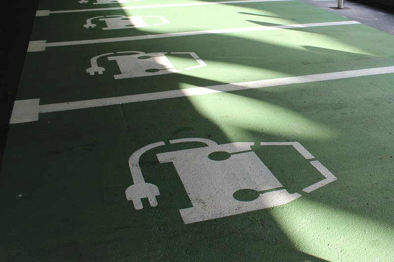 A car park with dedicated spaces for electric vehicles