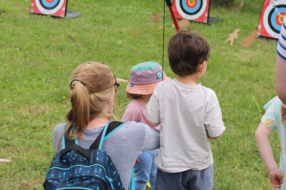 Children trying archery