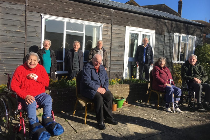 The Phoenix Stroke Club meet outdoors on a sunny day