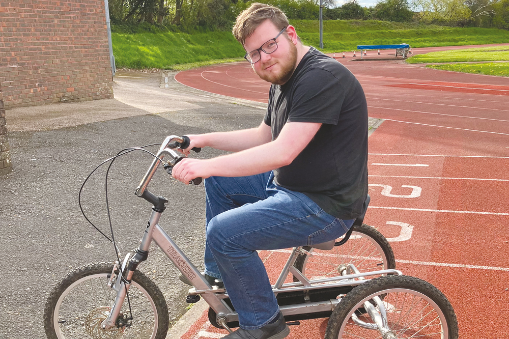 Ewan and the tricycle at a Wheels for ALL session