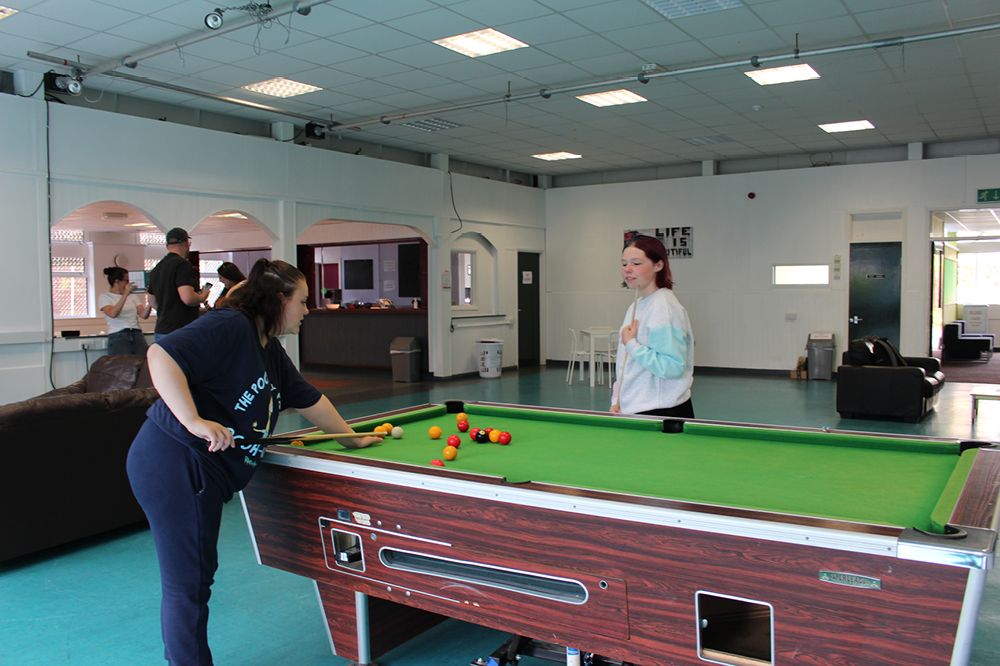 Young people playing pool