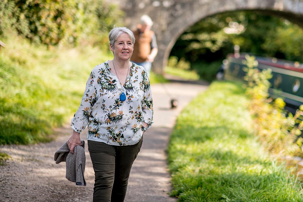 A woman walking with a Lifeline unit