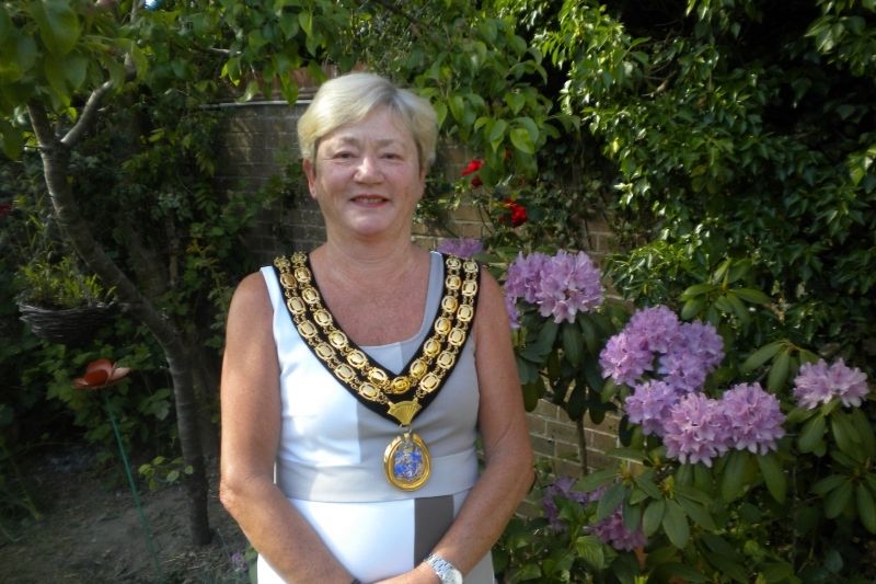 Councillor Kate Rowbottom stands with her Chairman's medallion