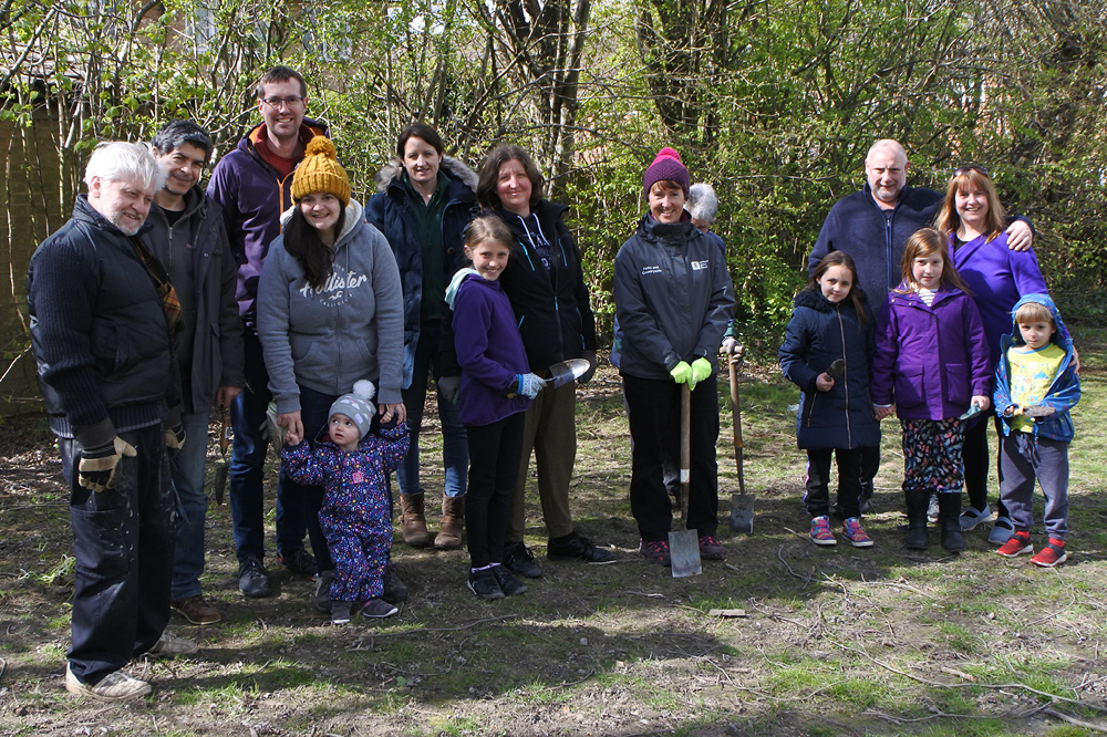 A group planting bluebells in Bluebell Park