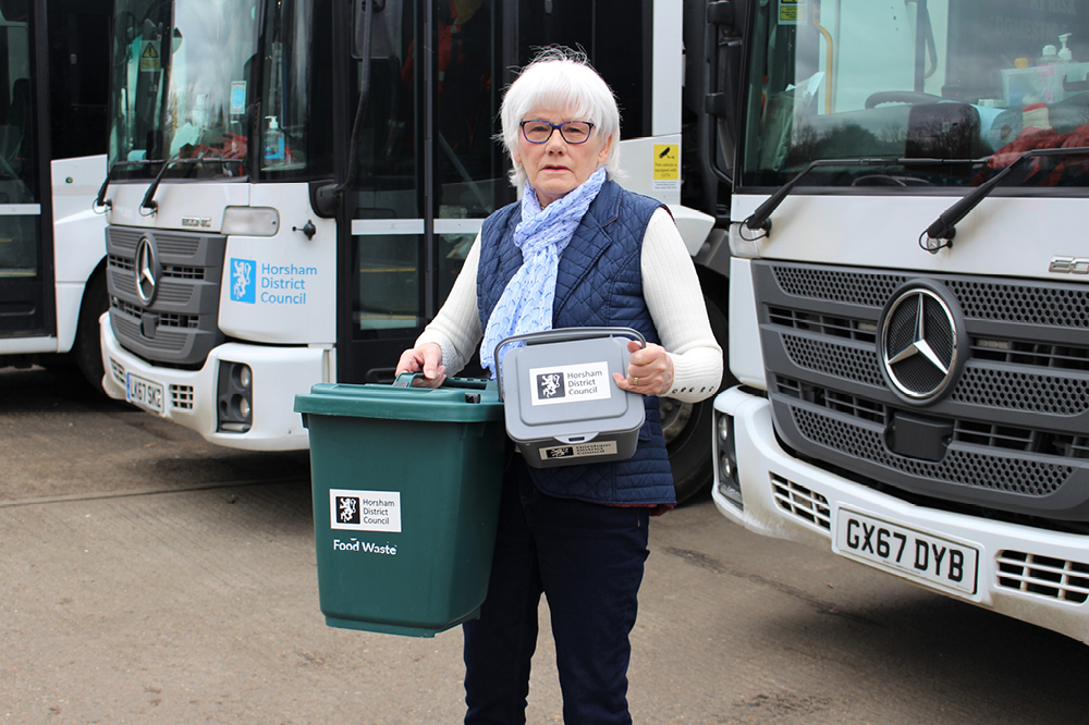 Cllr Toni Bradnum with food waste caddies